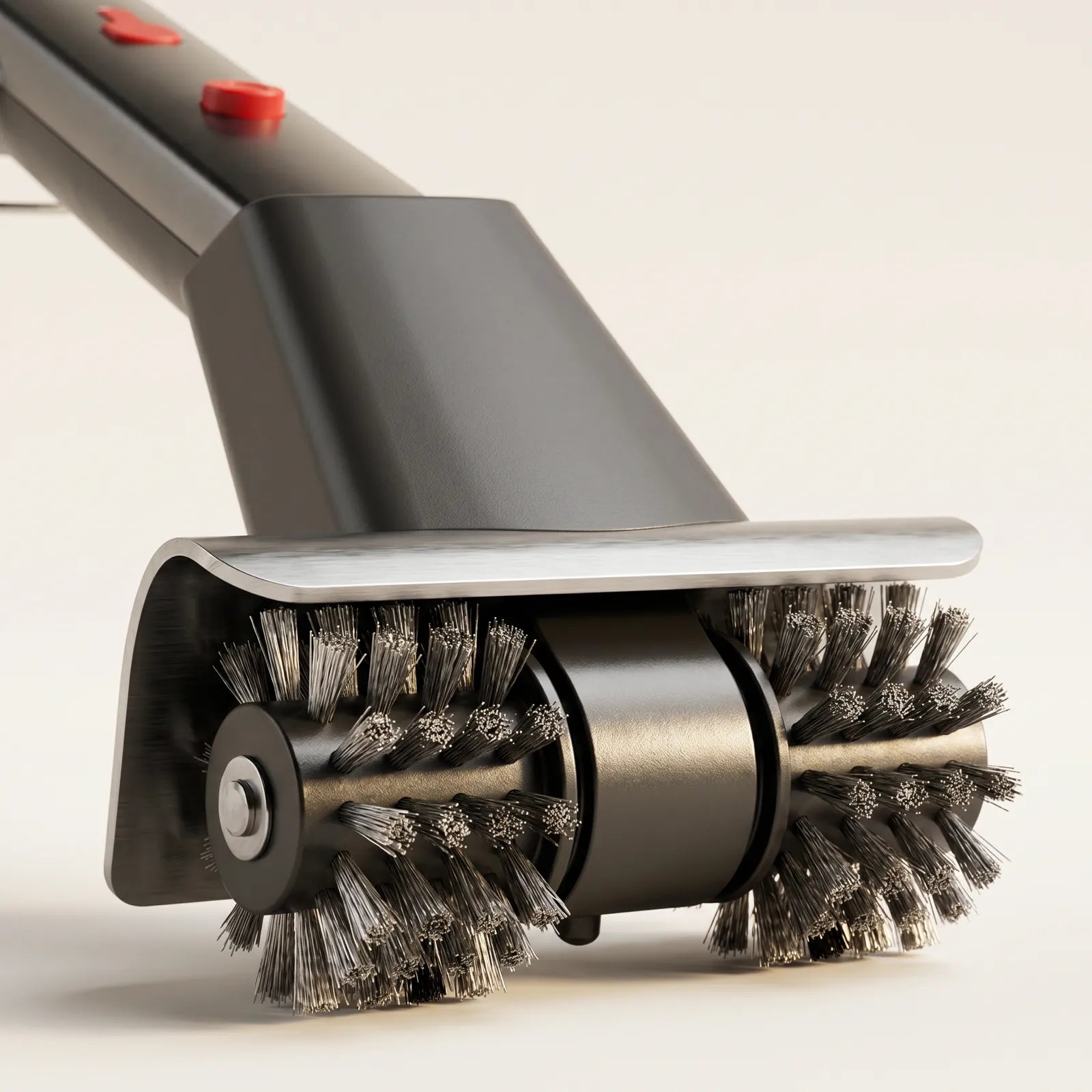 GRIZZLA brush head close-up showing the twin spinning stainless heads